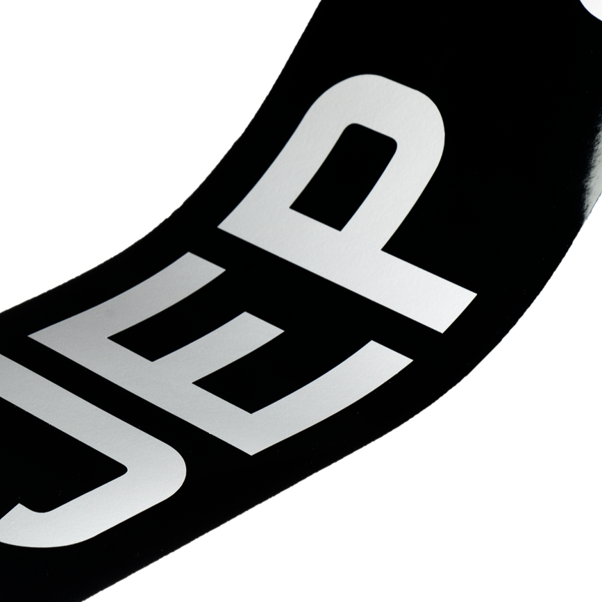 Self-adhesive: black oblong with white 3 1/8" digits